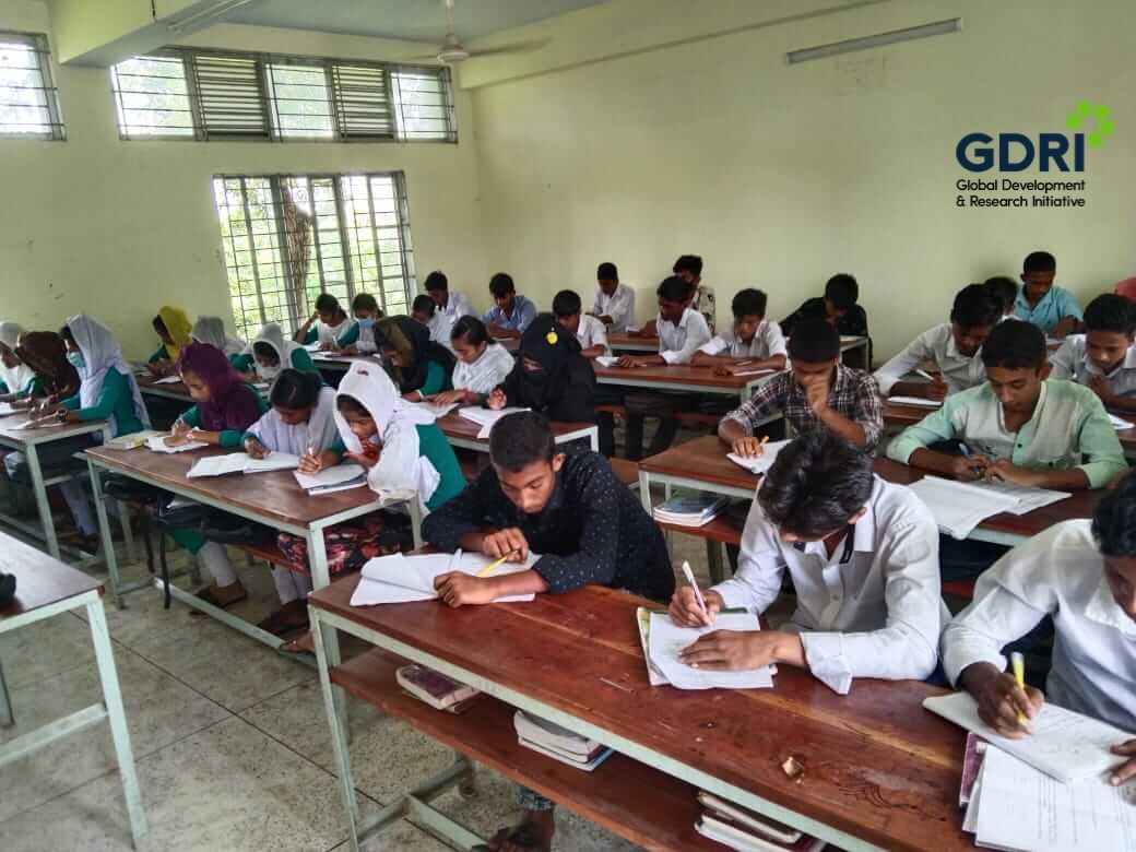 School students sitting for an assessment exam in a classroom