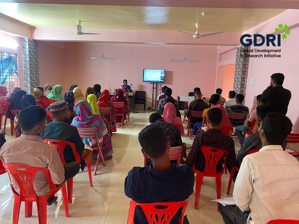 Data collectors attending a training session in a classroom setting
