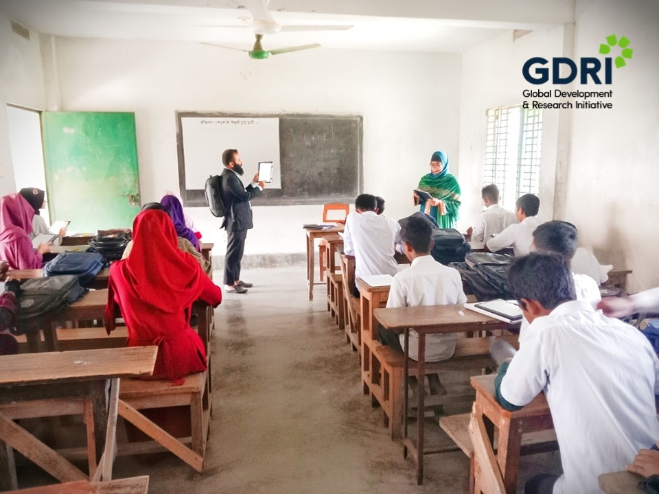 Primary school students taking assessments via iPads under the “Bridging Learning Gaps with Out-of-School Learning Program” project in Bangladesh