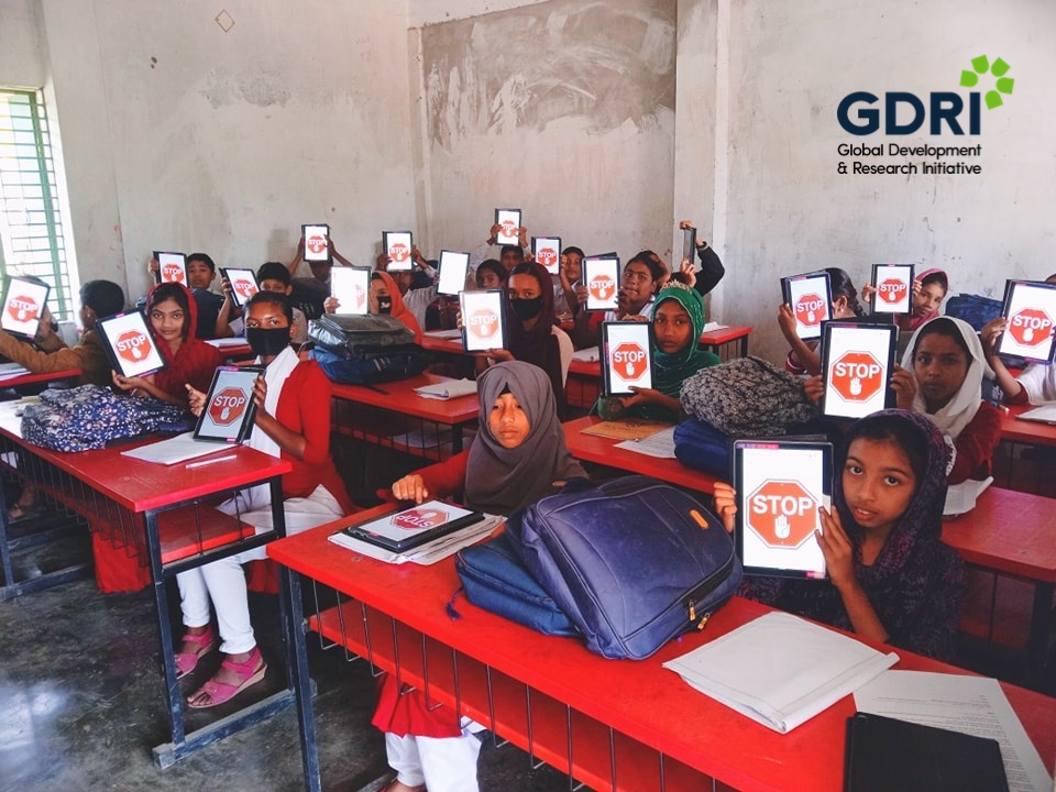 Primary school students taking assessments via iPads under the “Bridging Learning Gaps with Out-of-School Learning Program” project in Bangladesh